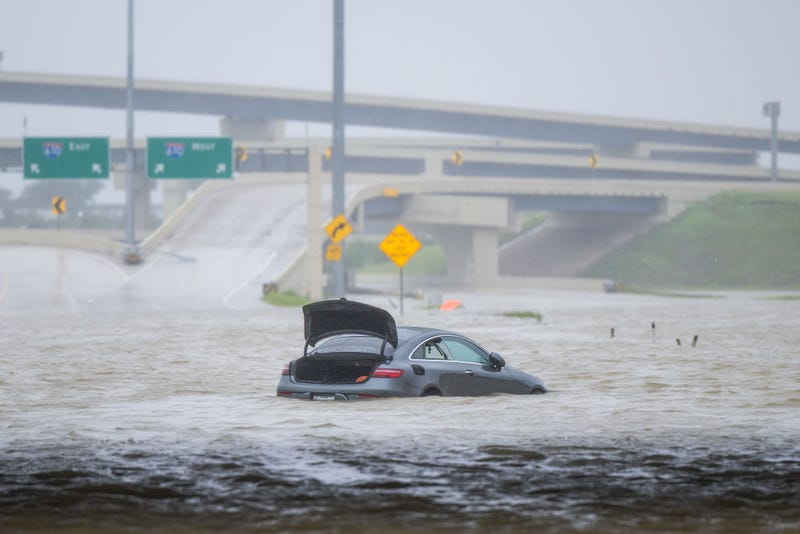 A vehicle is left abandoned in floodwater on a highway after Hurricane Beryl swept through the Houston area on July 8. Beryl developed from a tropical storm into a Category 1 hurricane as it hit the Texas coast late last night. 