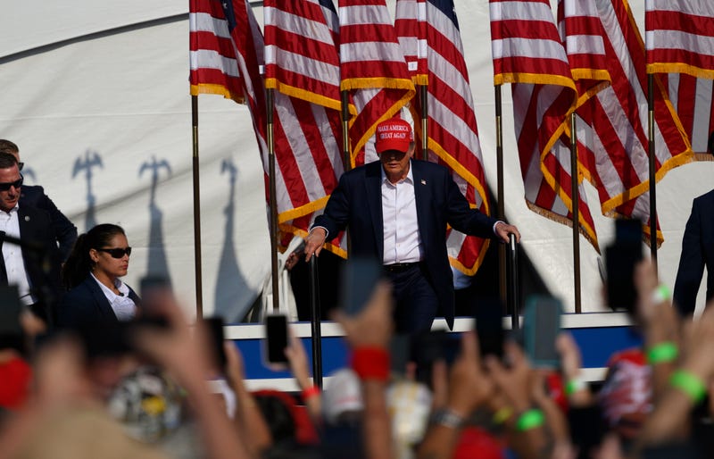 Donald Trump, on stage in Butler, Pennsylvania just before an assassination attempt, 7/13/24