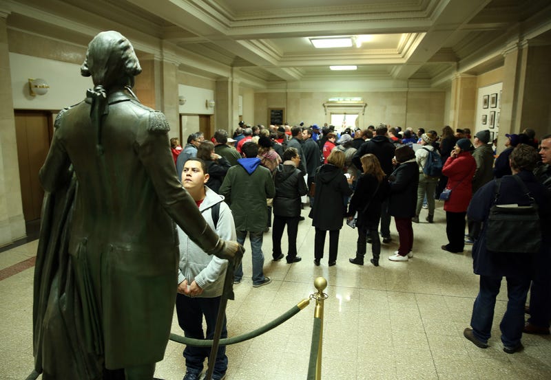 A student looks at a statue of George Washington outside the mayor's office in Chicago City Hall in 2012.