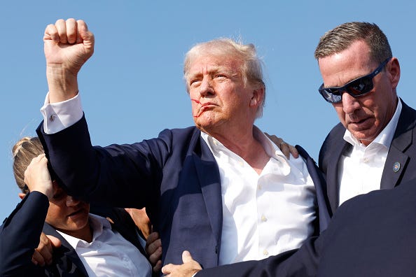Republican presidential candidate former President Donald Trump is rushed offstage during a rally on July 13, 2024 in Butler, Pennsylvania.