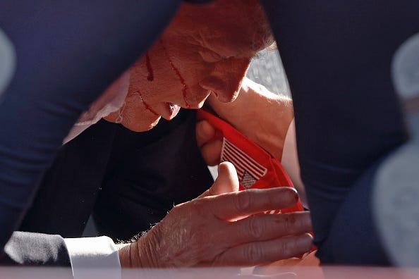 Secret Service tend to republican presidential candidate former President Donald Trump onstage at a rally on July 13, 2024 in Butler, Pennsylvania. 