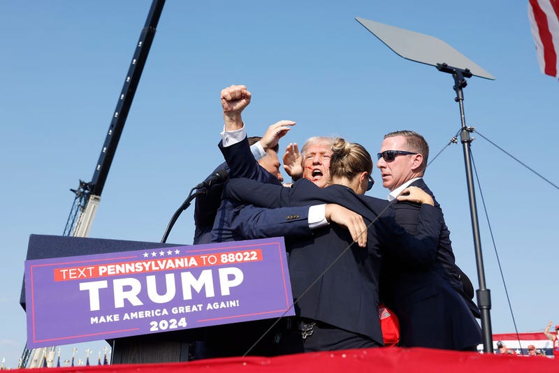 Republican presidential candidate former President Donald Trump is rushed offstage during a rally on July 13, 2024 in Butler, Pennsylvania. 