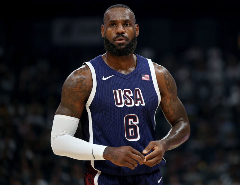 LeBron James #6 of the United States walks the court during the first half of an exhibition game between the United States and Australia ahead of the Paris Olympic Games at Etihad Arena on July 15, 2024 in Abu Dhabi, United Arab Emirates.