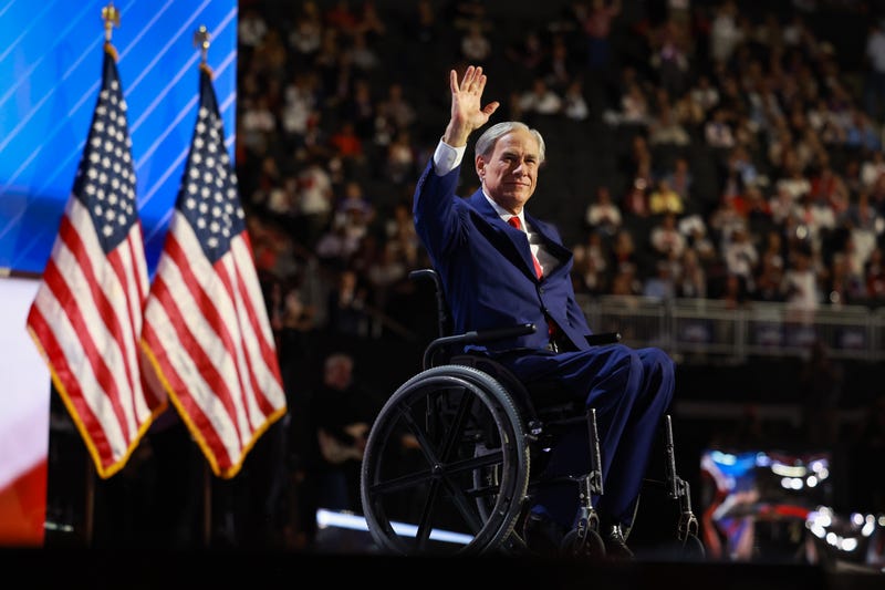 Texas Gov. Greg Abbott waves on stage on the third day of the Republican National Convention at the Fiserv Forum on July 17, 2024, in Milwaukee, Wisconsin.