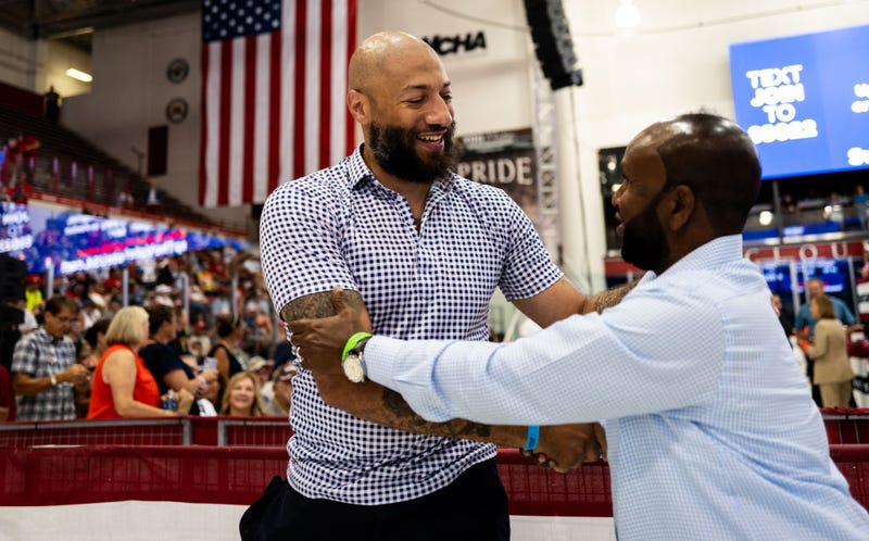 Republican candidate for Senate Royce White (L) greets attendees before a rally featuring U.S. Republican Presidential nominee former President Donald Trump and Republican vice presidential nominee U.S. Sen. J.D. Vance (R-OH) at Herb Brooks National Hockey Center on July 27, 2024 in St Cloud, Minnesota.  