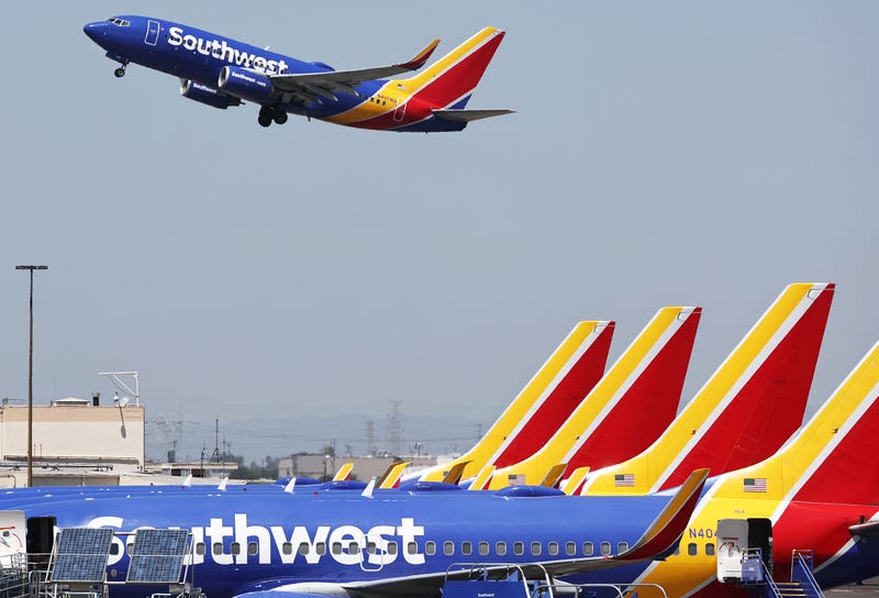 A Southwest Airlines plane takes off from Hollywood Burbank Airport as other Southwest planes are parked at their gates on July 25, 2024, in Burbank, California.