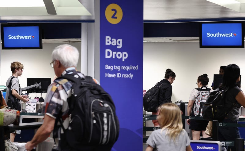 Travelers gather at the Southwest Airlines check-in area at Hollywood Burbank Airport on July 25, 2024, in Burbank, California.