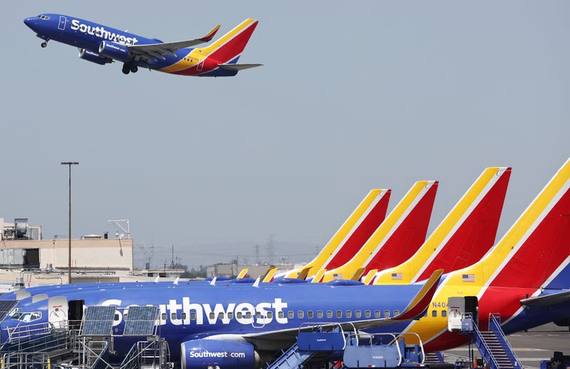 A Southwest Airlines plane takes off from Hollywood Burbank Airport as other Southwest planes are parked at their gates on July 25, 2024, in Burbank, California.