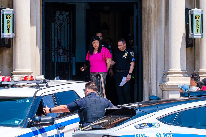 Brooklyn City Councilwoman Susan Zhuang, arrested during a protest, is removed by officers from the 62nd Precinct in Bath Beach for transport to Brooklyn Central Booking, on July 17, 2024