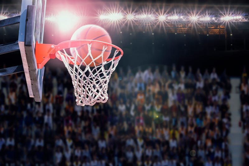 Basketball going into hoop