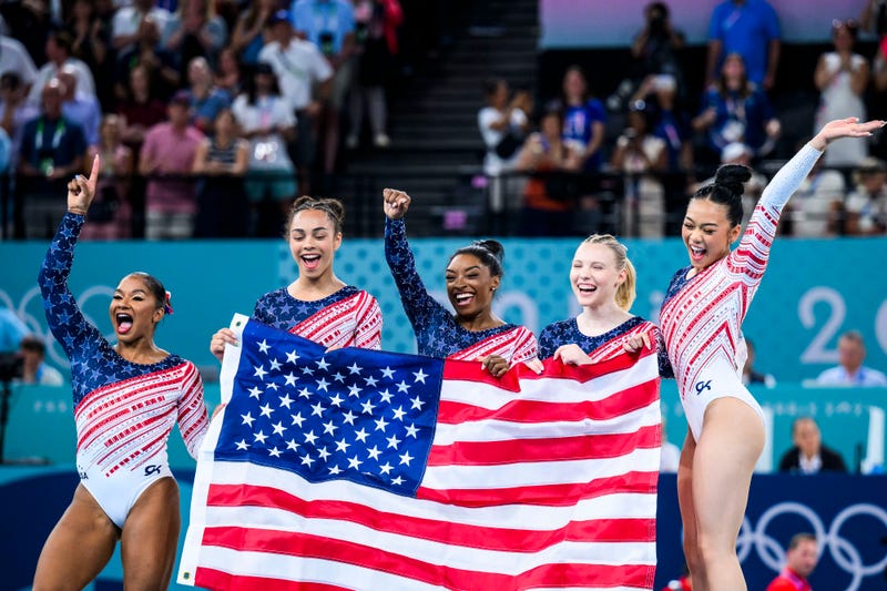 (From left to right) Jordan Chiles, Hezly Rivera, Simone Biles Jade Carey, and Sunisa Lee of Team United States celebrate winning the gold medal after the Artistic Gymnastics Women's Team Final on Day Four of the Olympic Games Paris 2024 at the Bercy Arena on July 30, 2024. in Paris, France.