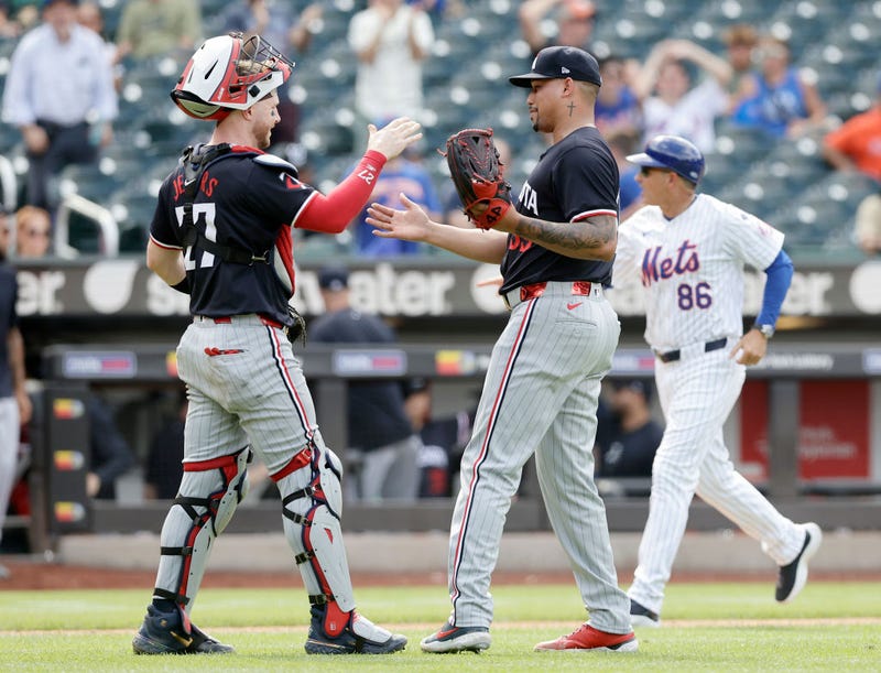 Ryan Jeffers #27 and Jhoan Duran #59 of the Minnesota Twins celebrate after defeating the New York Mets at Citi Field on July 31, 2024 in New York City. 