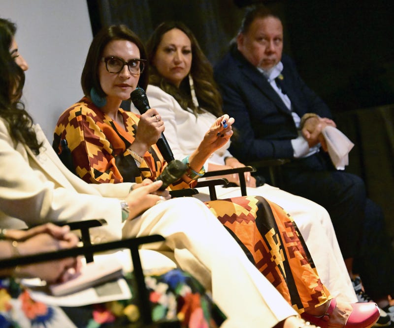 Peggy Flanagan (with mic) on stage as IllumiNative and the Native American Rights Fund host "Count Our Votes: The Power of Native Voices" event at Eaton Hotel on July 31, 2024 in Washington, DC.