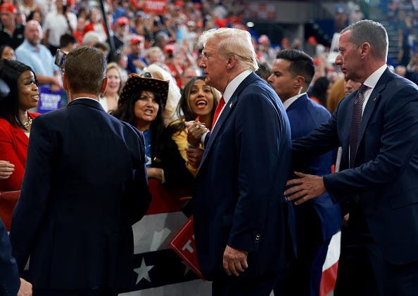 Republican presidential nominee, former U.S. President Donald Trump greets supporters after holding a campaign rally at the Georgia State University Convocation Center on August 03, 2024 in Atlanta, Georgia. 