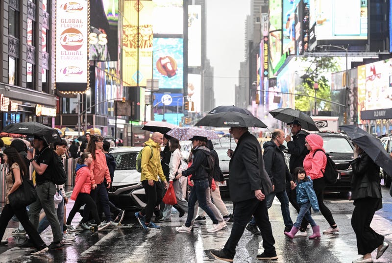 People across a street near Times Square on Aug. 8, 2024