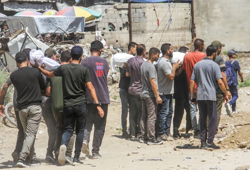 People in Gaza City on Monday prepare to bury victims of an Israeli airstrike. The Palestinian death toll from ongoing Israeli attacks on the Gaza Strip has soared past 40,000 people, according to Gaza-based health authorities.