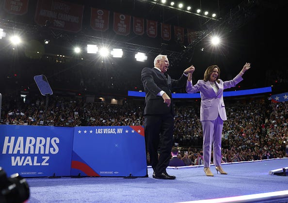 Democratic presidential candidate, U.S. Vice President Kamala Harris (R) and Democratic vice presidential candidate Minnesota Governor Tim Walz (L) appear at a campaign rally at the University of Las Vegas Thomas & Mack Center on August 10, 2024 in Las Vegas, Nevada. 