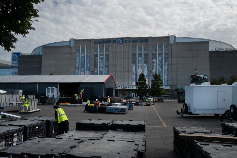 Workers prepare the United Center