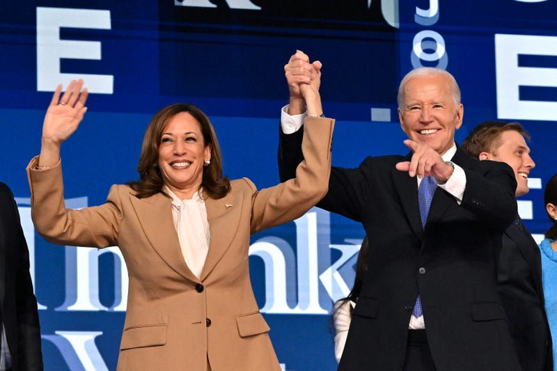 President Joe Biden holds US Vice President and 2024 Democratic presidential candidate Kamala Harris hand after delivering the keynote address on the first day of the Democratic National Convention (DNC) at the United Center in Chicago, Illinois, on August 19, 2024