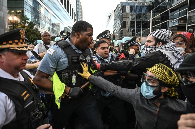 Chicago police officers and pro-Palestinian protesters clashed Tuesday night outside of the Israeli Consulate. Chicago Police Supt. Larry Snelling said officers issued a mass arrest after protesters charged at a line of police who blocked their march.