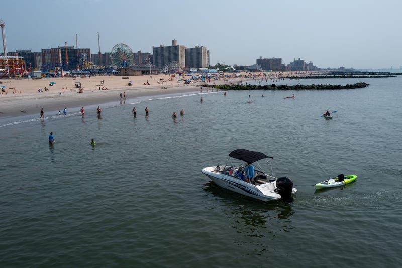 People enjoy a late morning at Coney Island Beach on August 16, 2024. Conditions are expected to be nice for Labor Day