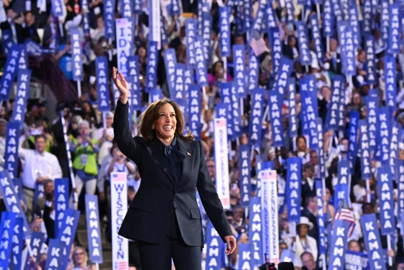 Vice President and 2024 Democratic presidential candidate Kamala Harris waves as she arrives to speak at the Democratic National Convention in Chicago.