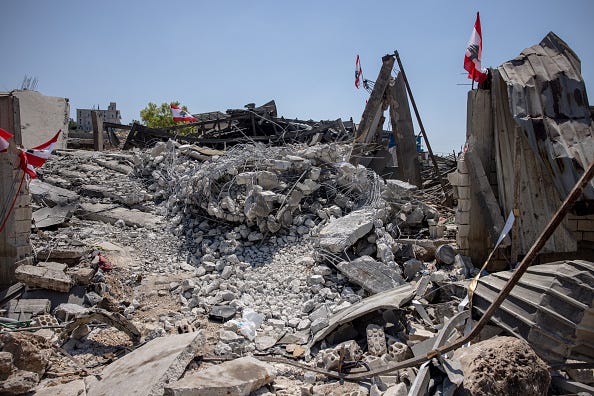 Rubble of a factory destroyed by an Israeli airstrike on August 17, that killed ten Syrian nationals is seen on August 18, 2024 in Nabatieh, Lebanon. 