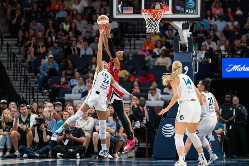 Forward Napheesa Collier #24 of the Minnesota Lynx and center A'ja Wilson #22 of the Las Vegas Aces go up for a rebound at Target Center on August 23, 2024 in Minneapolis, Minnesota.