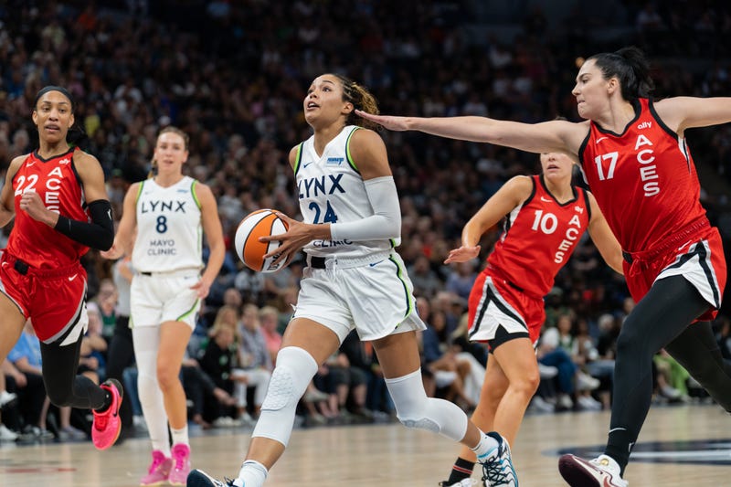 Forward Napheesa Collier #24 of the Minnesota Lynx drives to the basket past center Megan Gustafson #17 of the Las Vegas Aces at Target Center. (Photo by Ben Brewer/Getty Images)