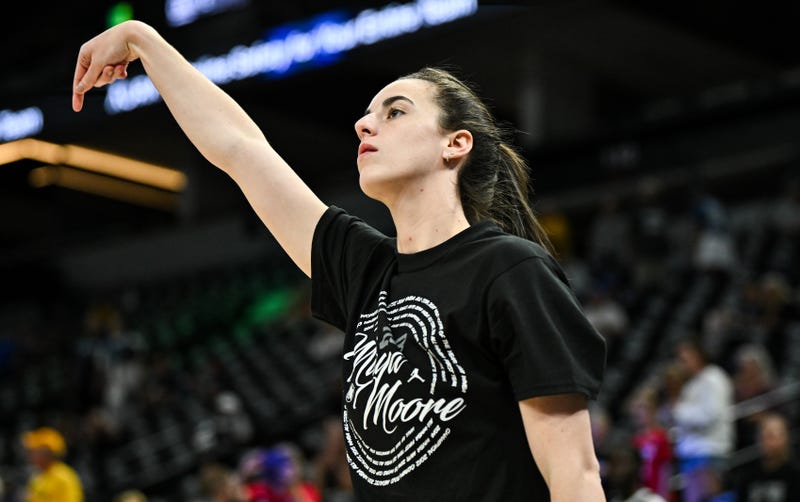 Caitlin Clark #22 of the Indiana Fever wears a shirt honoring Maya Moore as she warms up before the game against the Minnesota Lynx at Target Center on Aug. 24, 2024, in Minneapolis, Minnesota.