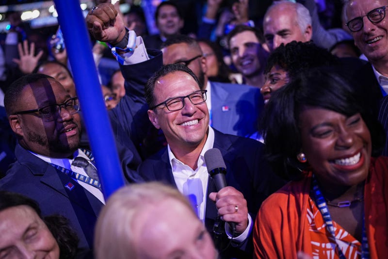 Pennsylvania Gov. Josh Shapiro joins the Pennsylvania delegation as they cast their votes during the Ceremonial Roll Call of States on the second day of the Democratic National Convention at the United Center