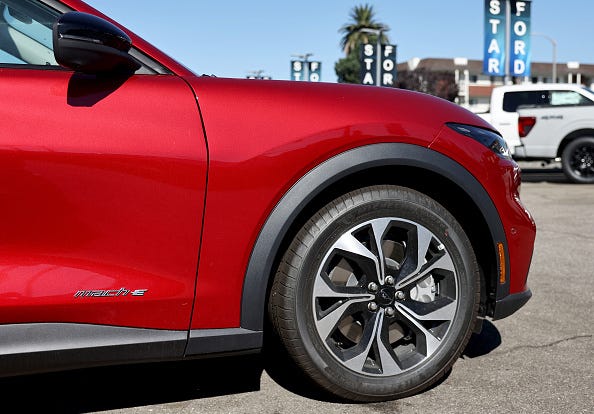 A Ford Mustang Mach-E electric vehicle is displayed for sale at a Ford dealership on August 21, 2024 in Glendale, California.