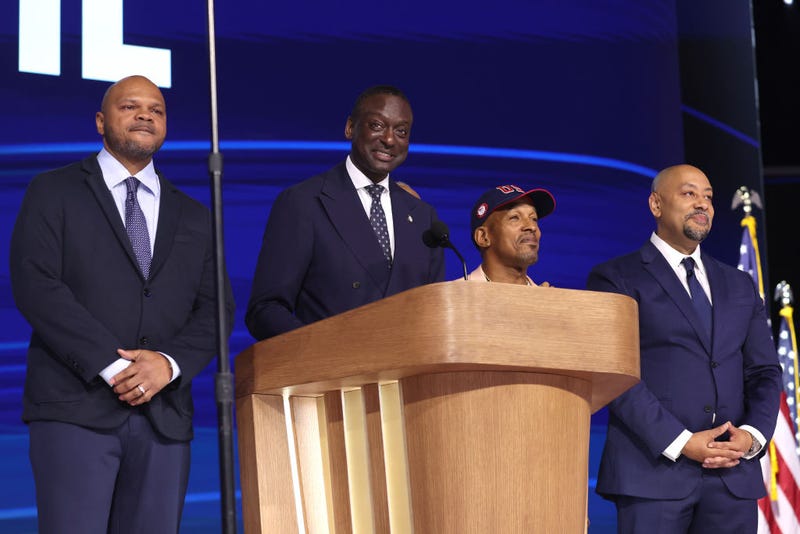 Representatives from the "Central Park Five,” New York City Council Member Dr. Yusef Salaam (2nd-L) speaks on stage as (L-R) Activist Kevin Richardson, Activist Korey Wise, and Activist Raymond Santana look on during the final day of the Democratic National Convention at the United Center on Aug. 22, 2024 in Chicago, Illinois.