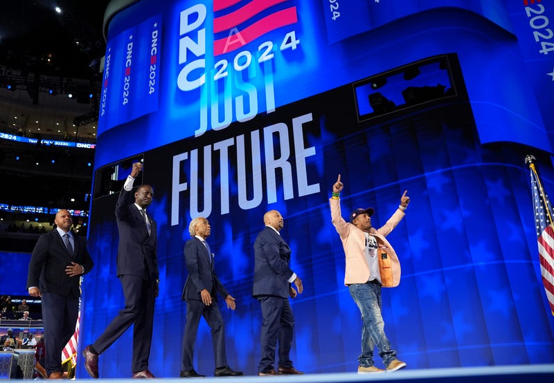 From left: activist Kevin Richardson, New York City Council Member Dr. Yusef Salaam, Rev. Al Sharpton, activist Raymond Santana and activist Korey Wise, representing the "Central Park Five,” depart after speaking during the final day of the Democratic National Convention in Chicago.