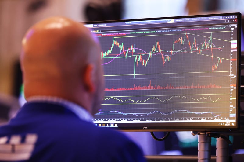 Traders work on the floor of the New York Stock Exchange