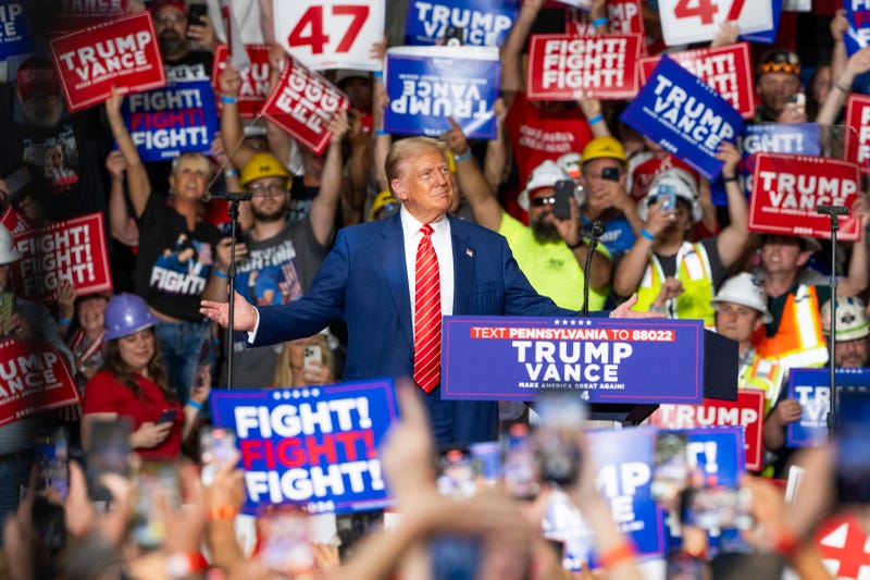 Former US President and Republican presidential candidate Donald Trump reacts as he arrives to speak at a rally at 1st Summit Arena at the Cambria County War Memorial in Johnstown, Pennsylvania, on August 30, 2024