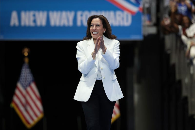 Democratic presidential nominee, U.S. Vice President Kamala Harris greets the crowd as she arrives on stage at a campaign rally 