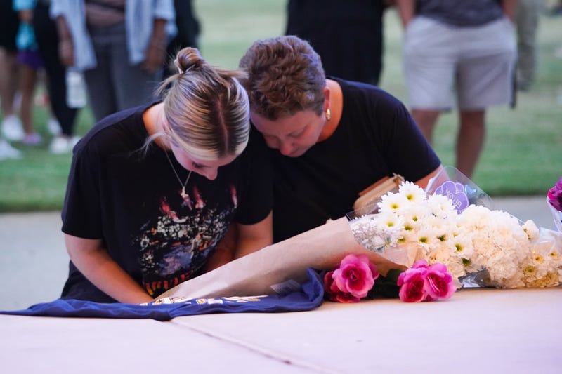 people gather at vigil