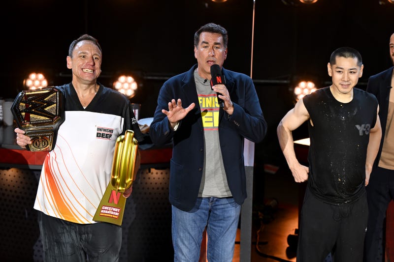 Joey Chestnut, Rob Riggle and Takeru Kobayashi speak onstage during LIVE Chestnut vs. Kobayashi: Unfinished Beef at the Hyper X Arena at the Luxor on Sept. 2, 2024 in Las Vegas, Nevada