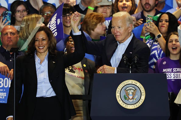 Democratic presidential nominee, U.S. Vice President Kamala Harris and U.S. President Joe Biden raise their hands during a campaign event at IBEW Local Union #5 on September 02, 2024 in Pittsburgh, Pennsylvania. 