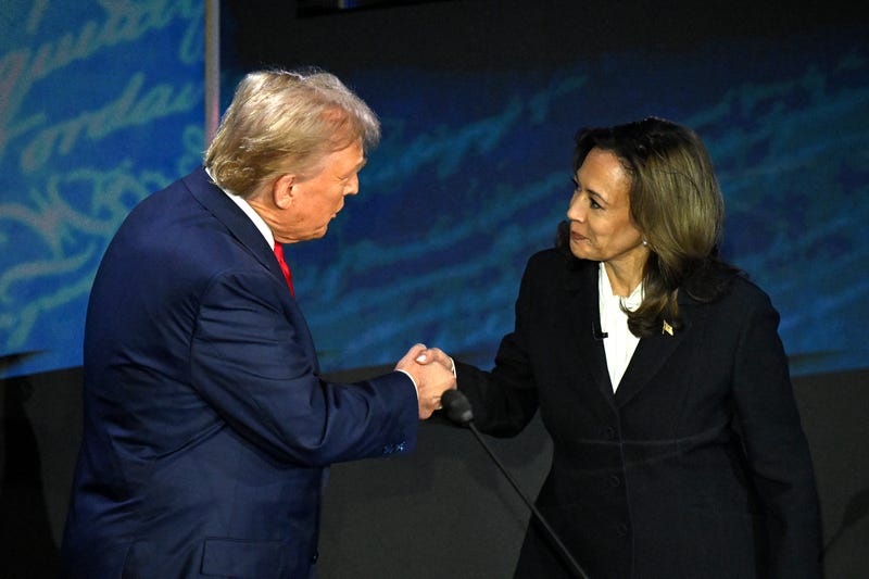 Former President Donald Trump (left) and Vice President Kamala Harris (right) shake hands at the presidential debate.