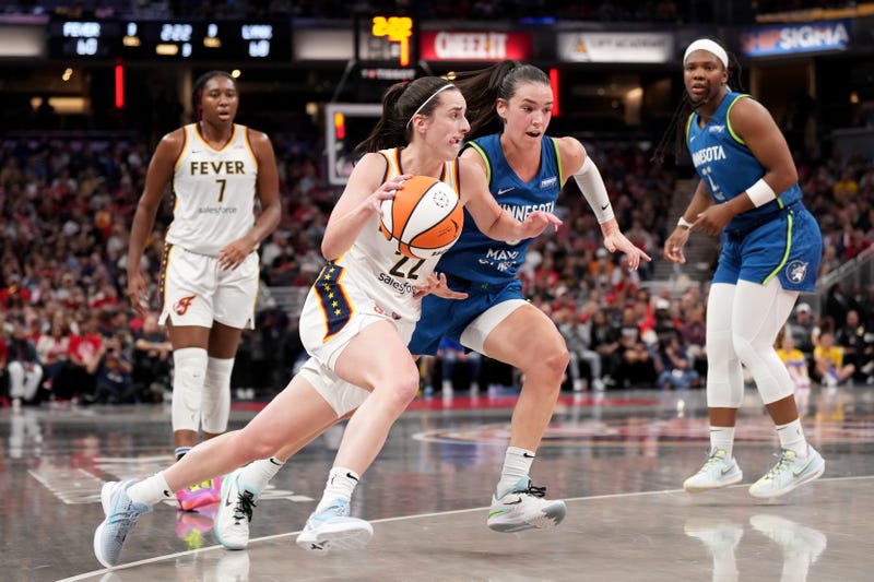 Caitlin Clark #22 of the Indiana Fever drives to the basket against Bridget Carleton #6 of the Minnesota Lynx during the second half at Gainbridge Fieldhouse on September 06, 2024 in Indianapolis, Indiana.