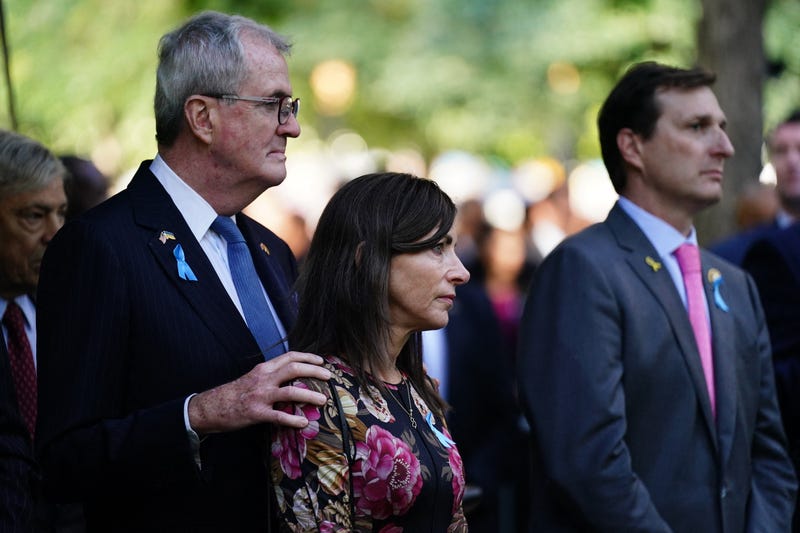 New Jersey Gov. Phil Murphy (L) and his wife Tammy Murphy attend the remembrance ceremony