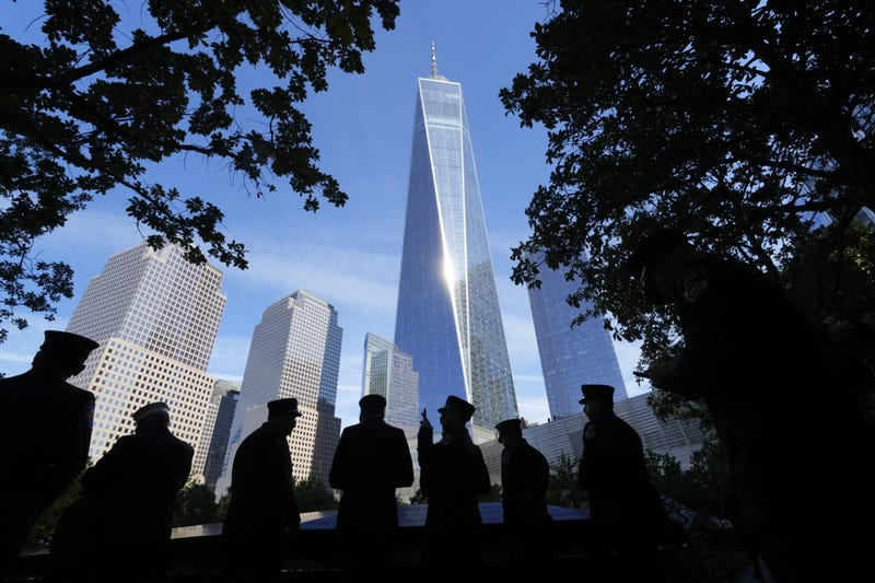 People look at the names of victims on the South Tower Memorial Pool during during the 23rd anniversary of the September 11 terror attacks