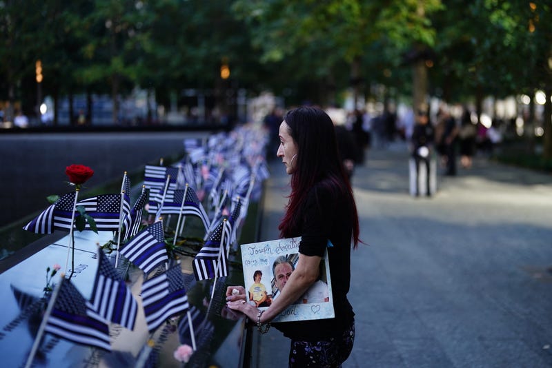 Flags adorned the memorial pools on Wednesday