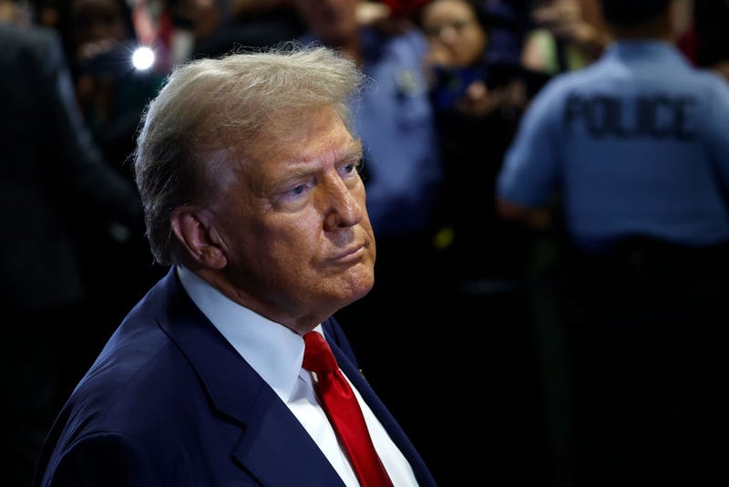 Republican presidential nominee Donald Trump speaks to reporters in the spin room after debating Democratic presidential nominee Kamala Harris in Philadelphia in September.