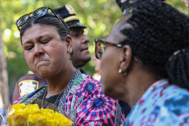 Family and friends of the victims attend the ceremony on Wednesday