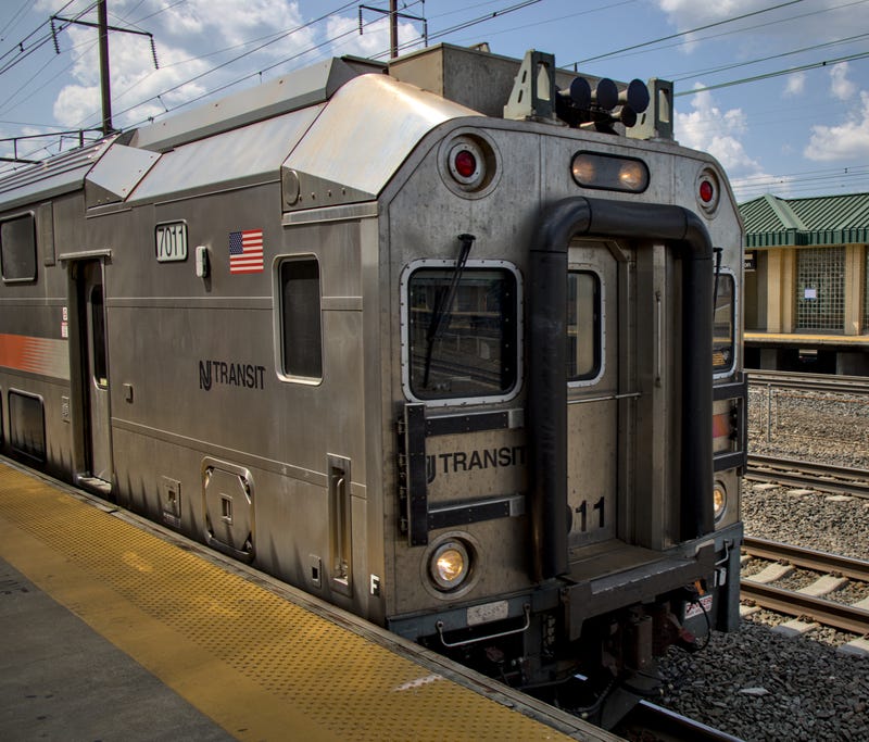 New Jersey Transit commuter rail train arriving on track at Rahway station in NJ.