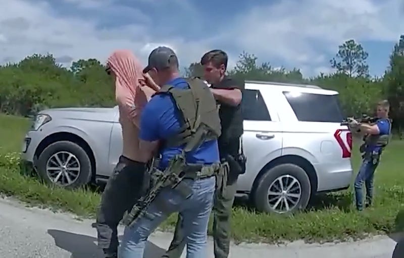 A screen grab captured from a video shows police forces arresting Ryan Wesley Routh, who is the suspect in an apparent assassination attempt on Trump in Florida on Sept. 15, 2024
