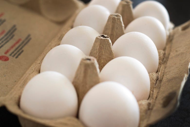 Open carton of eggs